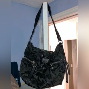 NWOT black canvas Coach Poppy purse with heart hardware and shoelace detail